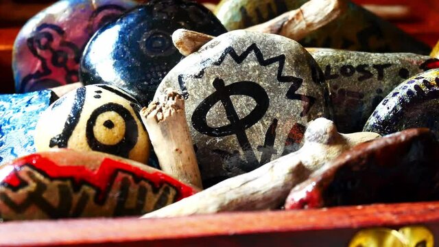 Mystery painted Viking patterned spiritual stones colourful hobby art collection in wooden box with burning incense