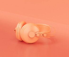 Monochrome orange color professional headphone on the floor in a pink studio, 3d rendering