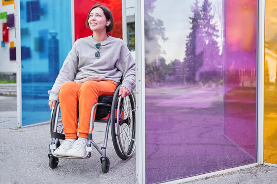 Disabled woman with loss of leg function sitting at the wheelchair