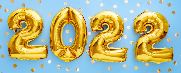 2022 Happy New year eve invitation with Christmas gold foil balloons calendar. 2022 numeral balloon gold text on Blue background with golden confetti for New year celebration. Long web banner.