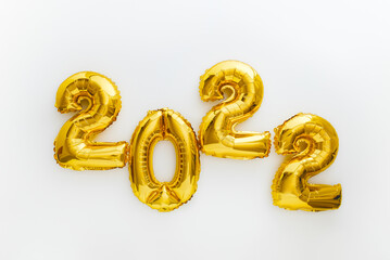 2022 gold balloons text Happy New year eve invitation with Christmas gold foil balloons calendar. 2022 numeral balloon on white background for Christmas and new year celebration. Long web banner