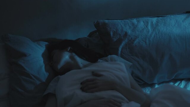 nightmare awakening bad dreams woman bed horror