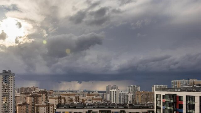 thunderstorm over the city, storm clouds in a storm over the residential buildings of the city
