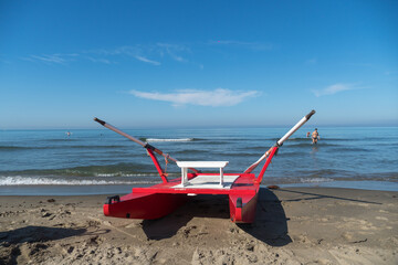 Fototapeta na wymiar Rescue rowing catamaran on the sand