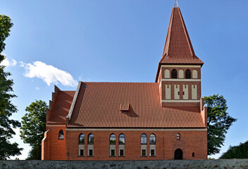 General view and architectural details of the Catholic Church of Our Lady Queen of Poland, built in 1894 in the Gothic style, in Pisanica in Masuria, Poland.