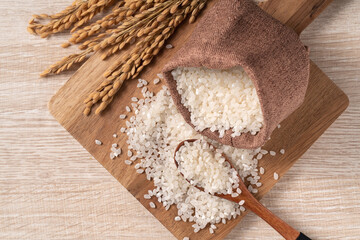 Fototapeta na wymiar White rice in a bowl on wooden table background.