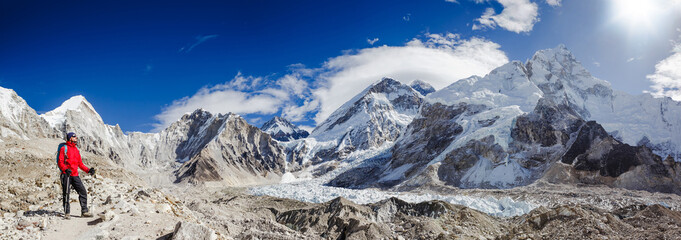 Active hiker hiking, enjoying the view, looking at Himalaya mountains landscape. Khumbu valley....