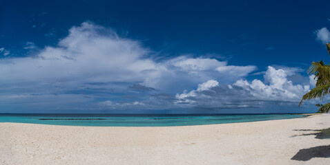 Untouched lonely tropical beach in Maldives Crossroads. July 2021. View from the water