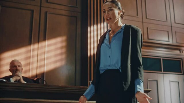 Court of Justice and Law Trial: Successful Female Public Defender Presenting the Case, Making Passionate Speech to Judge, Jury. Attorney Lawyer Protecting Client with Closing Not Guilty Arguments