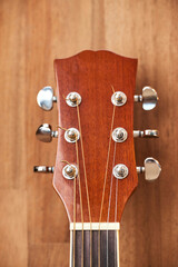 Front view of a guitar headstock. Close-up vertical image.