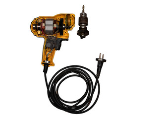 detachable used electric drill on white background The lid opens to reveal the internal components that include the motor, gear and switch.