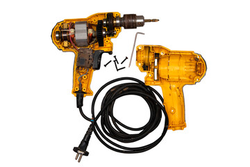 detachable used electric drill on white background The lid opens to reveal the internal components that include the motor, gear and switch.