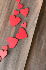 red hearts on wooden background