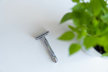 Vintage safety metal razor on a white background. Close-up. Isolated on white background. Reusable...