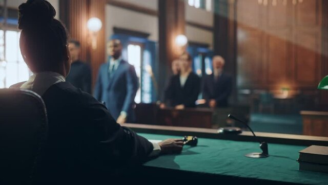 Cinematic Court of Law and Justice Trial: Female Judge Ruling Out a Decision in a Civil Family Case, Striking Gavel to Close Hearing. Convicted Male Defendant is Heartbroken, Lawyer Provides Support.