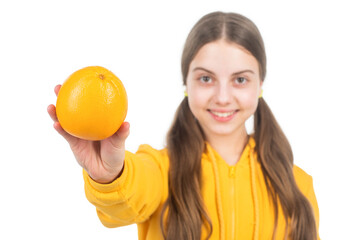 diet and kid skin beauty. orange citrus fruit in hand of happy teen girl. selective focus.