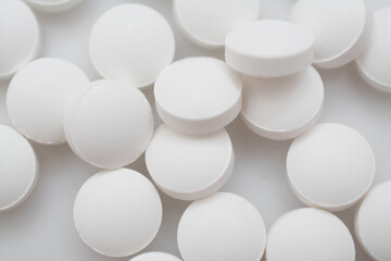 white pills on white