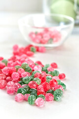 food, confectionery and sweets concept - glass jar with colorful candy drops