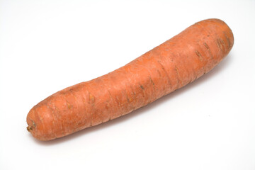 Dirty carrot isolated on white