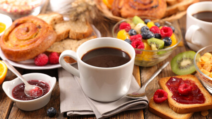 coffee cup with croissant and fresh fruits