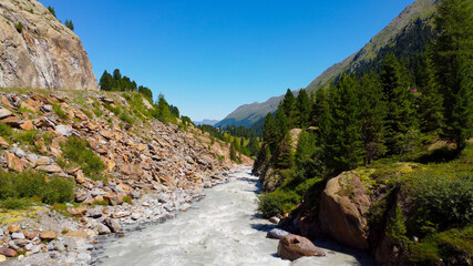 Fototapeta premium Small Creek in Kaunertal Valley in the Austrian Alps - famous glacier in Austria - travel photography by drone