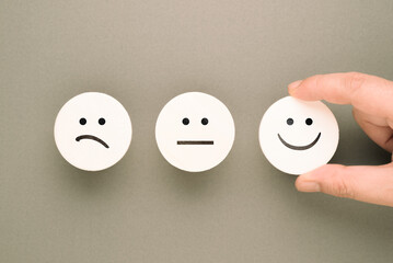 Emotion Icon Face on Brown Paper (Satisfaction Concept)