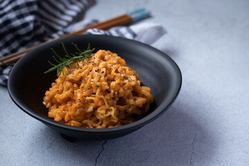 Korean instant noodles cheese flavor in a black cup