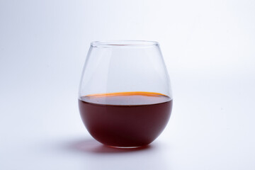 Thai tea drink in a clear glass on a white background
