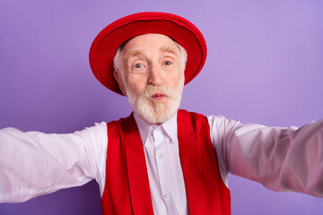 Photo of aged man pouted lips send air kiss romantic shoot selfie video isolated over violet color background