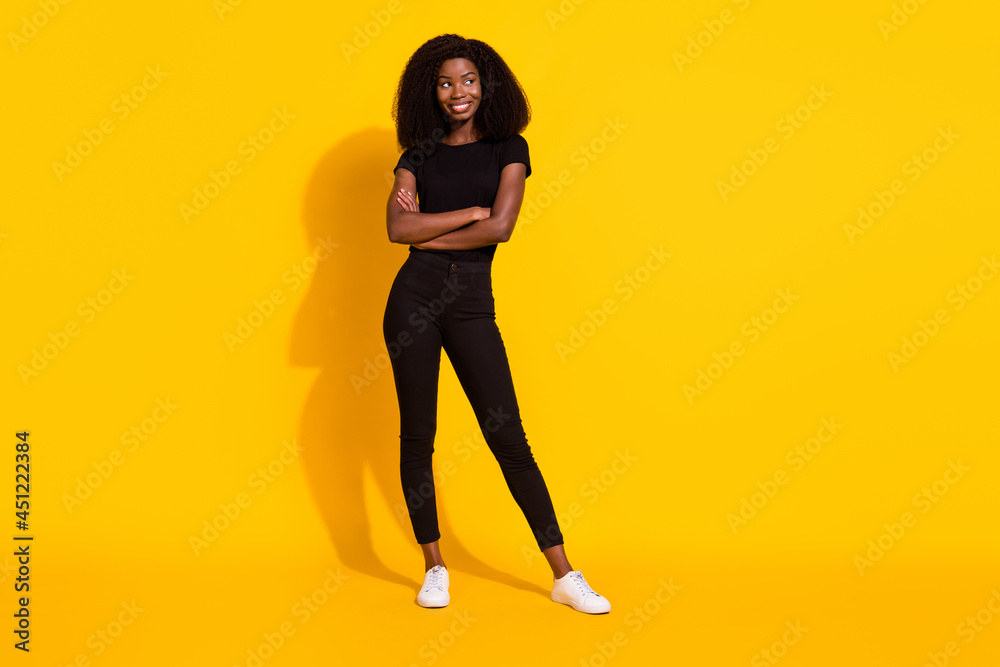 Wall mural Full length body size photo girl casual clothes smiling looking copyspace crossed hands isolated bright yellow color background