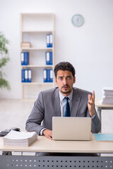 Two male colleagues working in the office