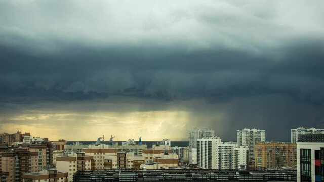 thunderstorm over the city, storm clouds in a storm over the residential buildings of the city