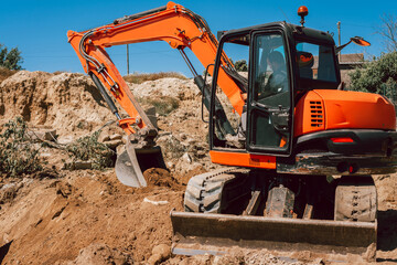 Excavator working with dirt on a construction site