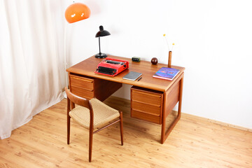 A mid century teak desk with drawers table from the 50s 60s Danish Design Vintage Dining solid wood Modern antique 50s 60s retro original isolated on white wall in modern living room side front view