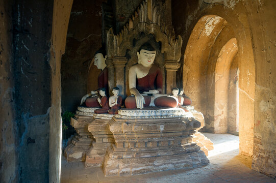 Myanmar (ex Birmanie). Bagan, Mandalay region. Seated Buddha inside a temple