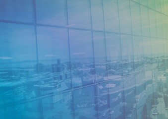 Obraz premium Composition of colorful light over cityscape reflected in window