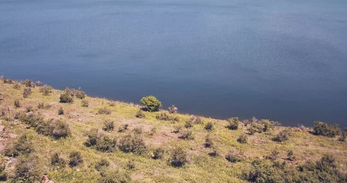 Drone flight over the famous Lake Sevan with clear water in Armenia. 