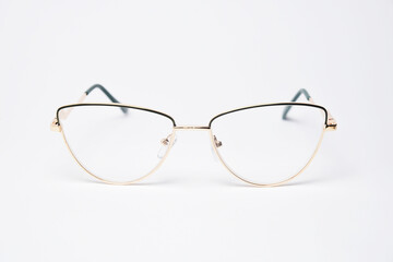 Fototapeta premium Golden stylish metal glasses front view. Eyewear modern diopter glasses