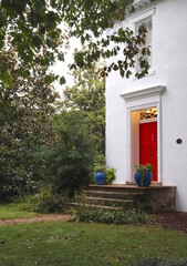 Fototapeta na wymiar Colonial Building Architecture Red Door
