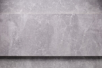 Abstract grey background texture at table or wall. Front view of gray panel plate at wall