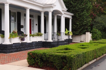 Beautiful White Home With Columns, Manicured Shrubbery
