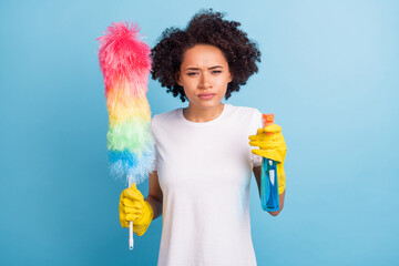 Portrait of young serious minded thoughtful afro girl shoot you bottle sprayer cleaning service...