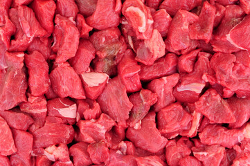 Fresh raw cubes of lean beef steak red meat background