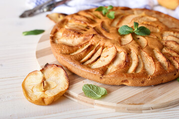 Appetizing pie close-up on a wooden background
