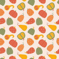 Seamless pattern with pumpkins Vector autumn texture in flat style on a light pink background.