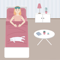 In the morning the girl woke up and lies in bed next to the cat.