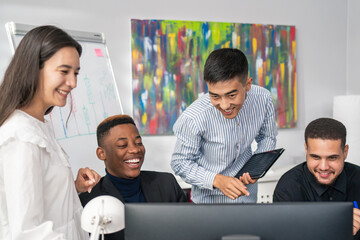 Five employees of corporation spend morning working hard on new project, they stare at computer monitor, take notes, collaboration, company atmosphere, successful people, business, brainstorming