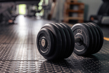 Plakat The dumbbell lies on the floor. Gym. Training