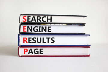 SERP symbol. Abbreviation SERP search engine results page on books. Beautiful white background. Copy space. Business and SERP search engine results page concept.