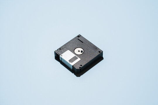 Pile of floppies on blue background